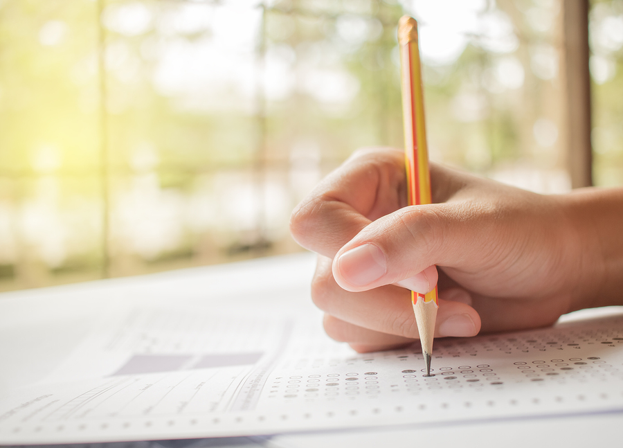 Someone filling in answers on an exam.
